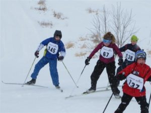 Nellie Stone skier Kristopher Cubias gaining speed in a race.