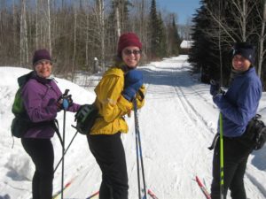 Friends Laura Silver, Kathleen Sullivanand Kaia Knutson embark on the Gunflint Trail System.