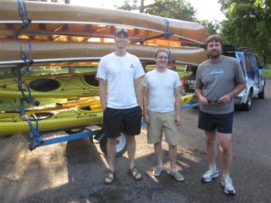 Boats being brought to Canoe Clinics at Cedar Lake.