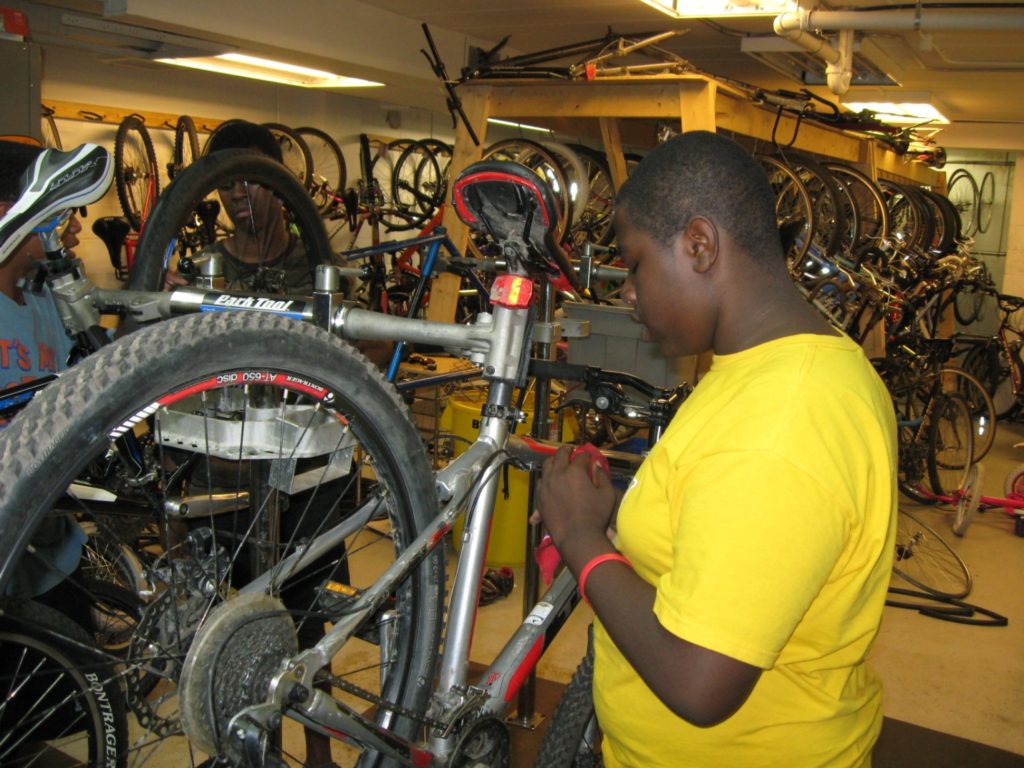 Figure 1: Damarion Turner learning to maintain his new bike