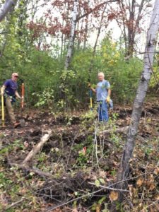 Trails Day Volunteers Jeff Jackson and Paul Holte working on the new mountain bike/event trails